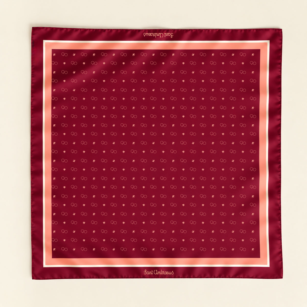 a red bandana with white and pink designs