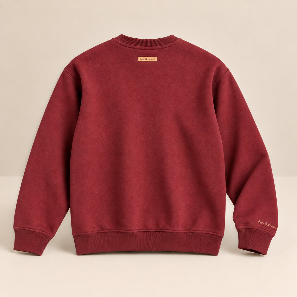 a red sweater on a white surface