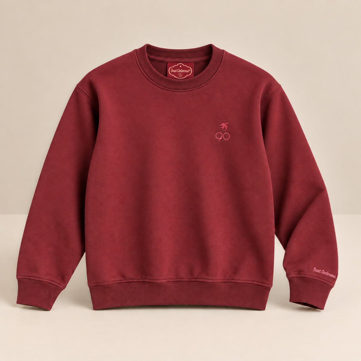 a red sweater with a logo on it