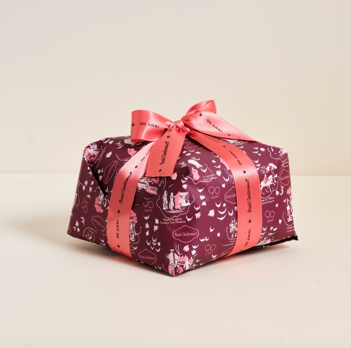 a wrapped present with a pink ribbon