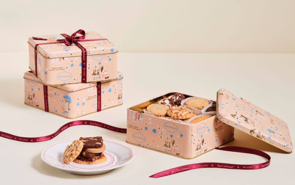 a box of cookies and a plate of cookies